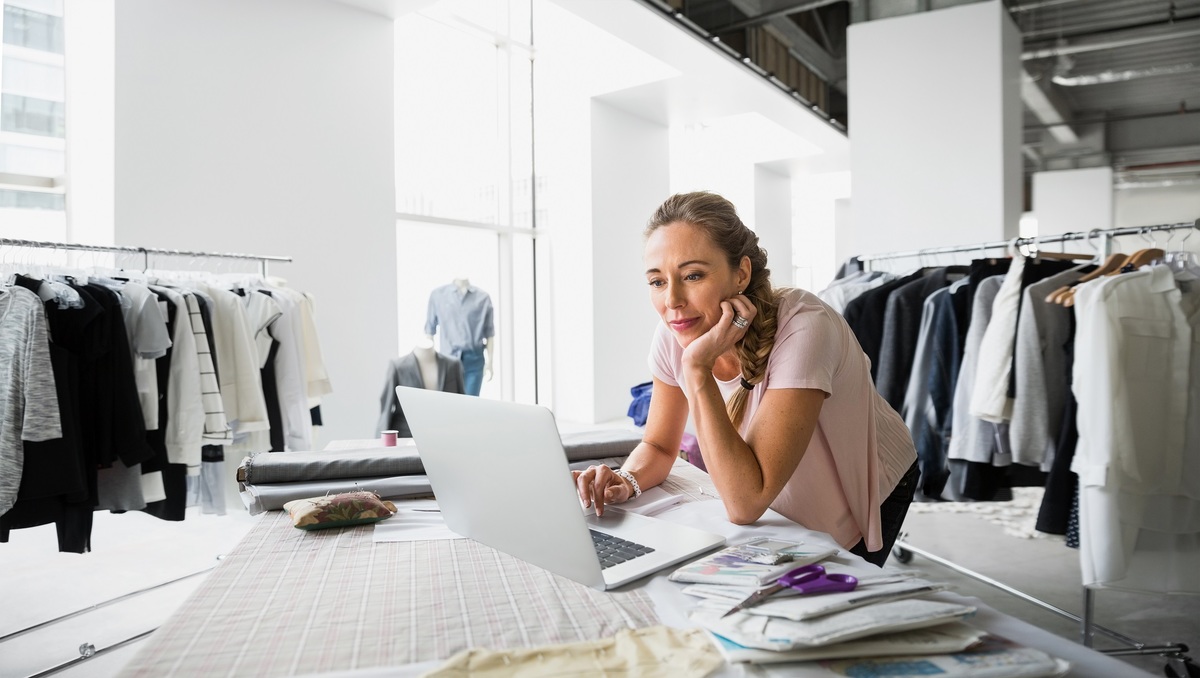 Fashion Designer Using Laptop