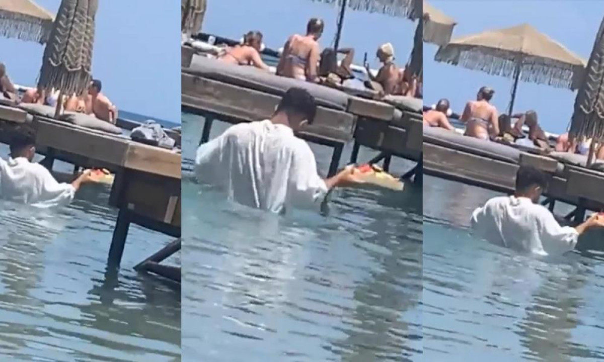 Παρέμβαση Γεωργιάδη για εργαζόμενο που σερβίρει… κολυμπώντας